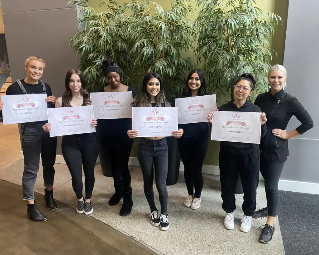 Beauty Angels Academy students holding course certificates