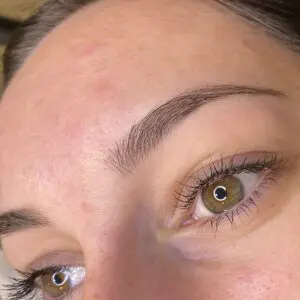 Close-up of natural hair-stroke brows on an Eastside client.
