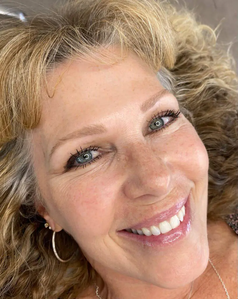 Smiling client with healed permanent makeup brows