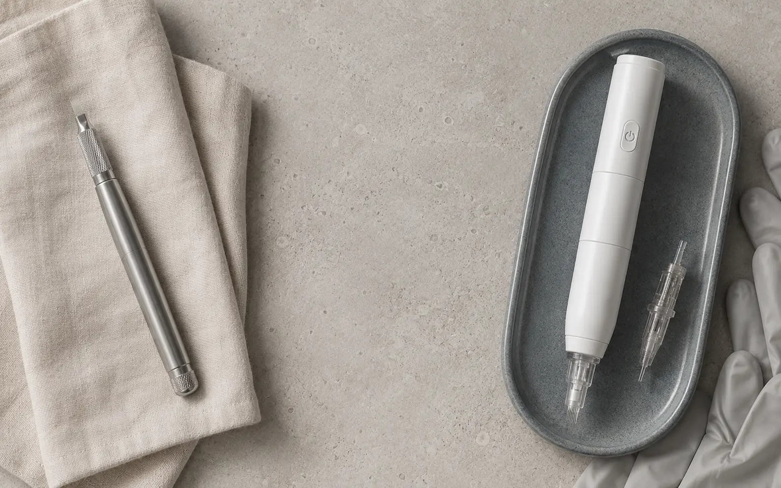 A microblading hand-tool blade beside a nano single-needle digital machine at Eastside